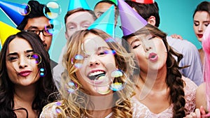 Diversity, dance and portrait of friends at party with colorful hats, bubbles and happy mood. Celebrate, youth and gen z