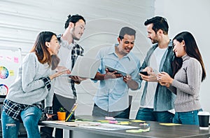 Diversity Designer in casual cloth using technology device at meeting table in meeting room at creative office