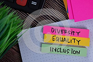 Diversity Equality Inclusion write on a sticky note isolated on Office Desk