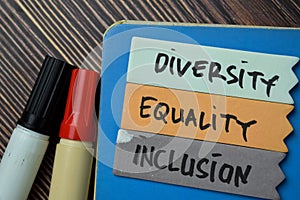 Diversity Equality Inclusion write on a sticky note isolated on Office Desk