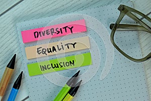 Diversity Equality Inclusion write on a sticky note isolated on Office Desk