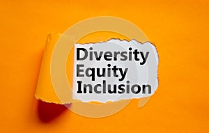 Diversity, equity, inclusion DEI symbol. Words DEI, diversity, equity, inclusion appearing behind torn orange paper. Orange