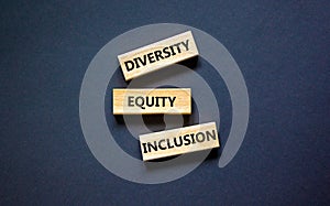 Diversity equity inclusion symbol. Concept words diversity equity inclusion on blocks on beautiful black table black background.