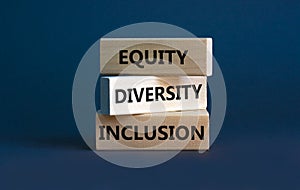 Diversity equity inclusion symbol. Concept words `Diversity equity inclusion` on wooden blocks on beautiful grey background.