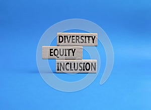 Diversity Equity Inclusion symbol. Concept words Diversity Equity Inclusion on wooden blocks. Beautiful grey background. Business