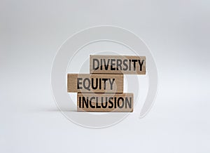 Diversity Equity Inclusion symbol. Concept words Diversity Equity Inclusion on wooden blocks. Beautiful white background. Business