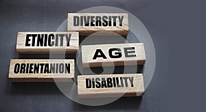 Diversity Etnicity age orientation disability words on wooden blocks. Social concept