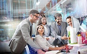 Diversity group of business people planning strategy gathered around computer desk.