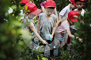 Diversity Group Of Kids Spray Water Garden