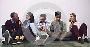 Diversity, group of student friends taking a selfie together and sitting by a white wall. Technology or networking