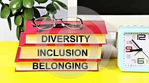 Diversity Inclusion Belonging. Text inscription on books. photo