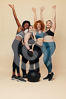 Diversity Models. Different Ethnicity And Size Women. Smiling Multicultural Friends In Sportswear Looking At Camera.