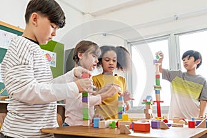 Diversity School kids playing wooden toy blocks