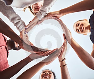 Diversity, teamwork and hands in circle synergy of employee workers together in collaboration and solidarity. Diverse