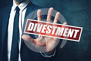 Divestment concept with businessman in suite