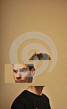 Divided head of a young man