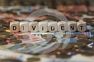 DIVIDENT - image with words associated with the topic STOCK EXCHANGE, word cloud, cube, letter, image, illustration