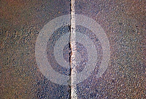 Dividing pit line on asphalt road background