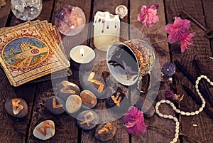 Divination rite with coffee and stone runes photo