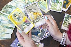 Divination by Tarot cards. The fortune teller predicts the fate of the cards