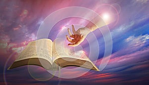 Divine hand of god with bible