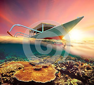 Diving boat at sunset