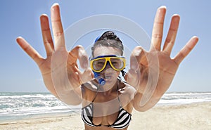 Diving girl in a swimming mask