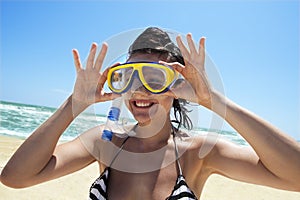 Diving girl in a swimming mask and snorkel