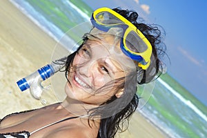 Diving girl in a swimming mask and snorkel