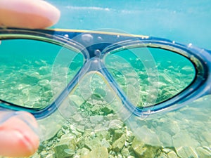 Diving goggles in the sea