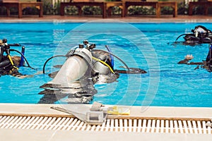 Diving instructor and students. Instructor teaches students to dive