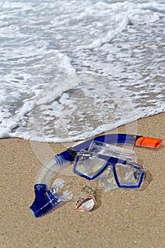 Diving mask and snorkel on the shore