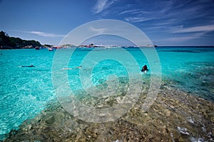 Diving people and boats on phuket island, similan island