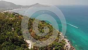 Diving resorts on tropical island. Drone view of Sairee Beach as part of diving resort on sunny day on exotic paradise Koh Tao