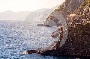 Diving from Riomaggiore cliffs