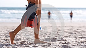 Diving, woman and walking on beach sand for summer vacation, freedom or travel adventure. Closeup girl with scuba diving