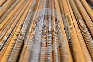 Division rebar - a closeup of rusty vertically stacked iron or steel reinforcement bars