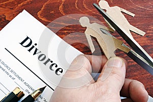 Divorce agreement form and figures of couple. Separation.