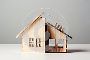 Divorce, division of property, poverty. Wooden broken house on light background. AI Generated