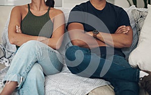 Divorce, fight and couple with arms crossed anger on a sofa frustrated by liar, cheating or breakup threat at home