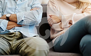 Divorce, sad and couple fight due on a couch due to marriage problem or conflict in a lounge sofa. Anger, fail and angry