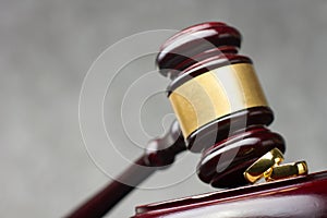 Divorce and separation concept. Two golden wedding rings and judge gavel