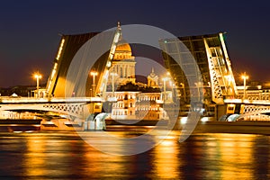 Divorced Annunciation Bridge on the background of the dome of St. Isaac Cathedral. Saint-Petersburg, Russia