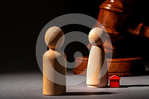 Divorse property division concept. Wooden family with house and judge gavel