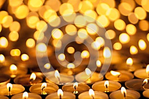 Diwali Festival of Lights. Beautiful candlelight. Selective focus on foreground of many burning tealight candles.