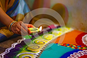 Diwali or festive of lights. Traditional Indian diwali festival, woman hands holding oil lamp