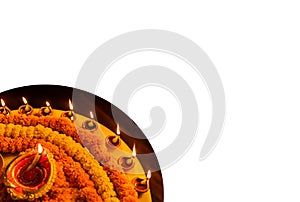 Diwali glowing Diya , flowers, Sweets and Gifts arranged in circular shape forming a design with copy space, selective focus ,