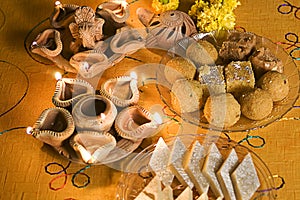 Diwali Lamps with Indian sweets (mithai)