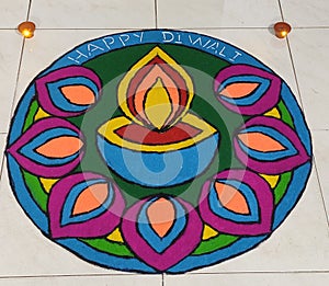 Diwali rangoli with lamp Diya and leaves design