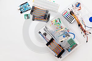 DIY arduino. Flat layout on white background, copy space. Electronic workshop components.